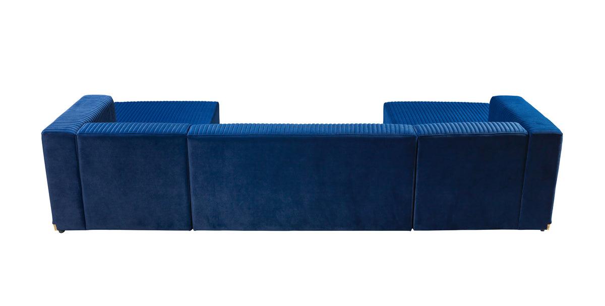 Close-up of blue velvet cushions on sectional sofa