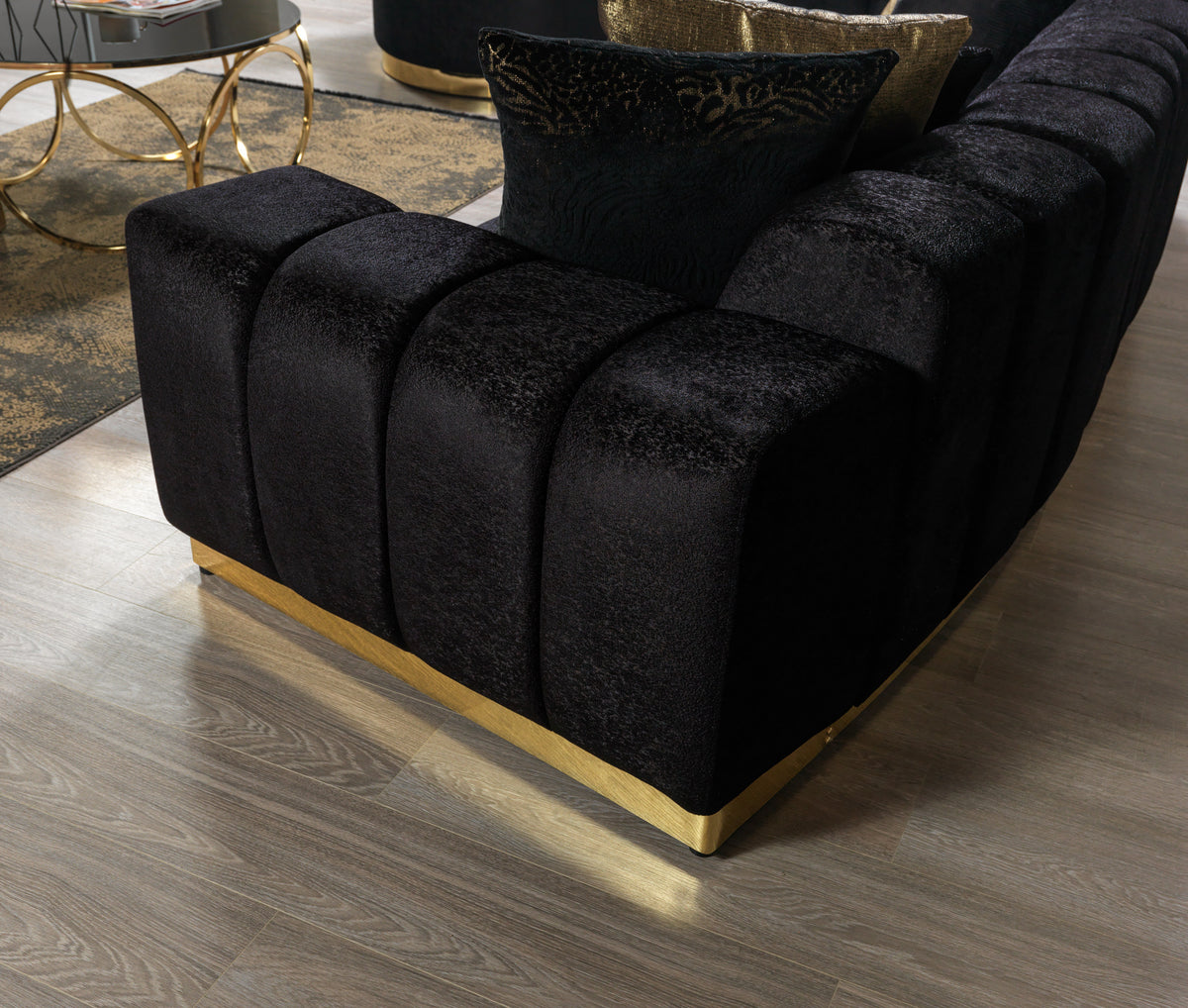 Anne Black Velvet Curved Sectional sofa front view in showroom