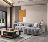 close-up detail of gray bouclé upholstery on sectional sofa