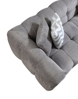 living area with Lili Gray Bouclé RAF Sectional Sofa