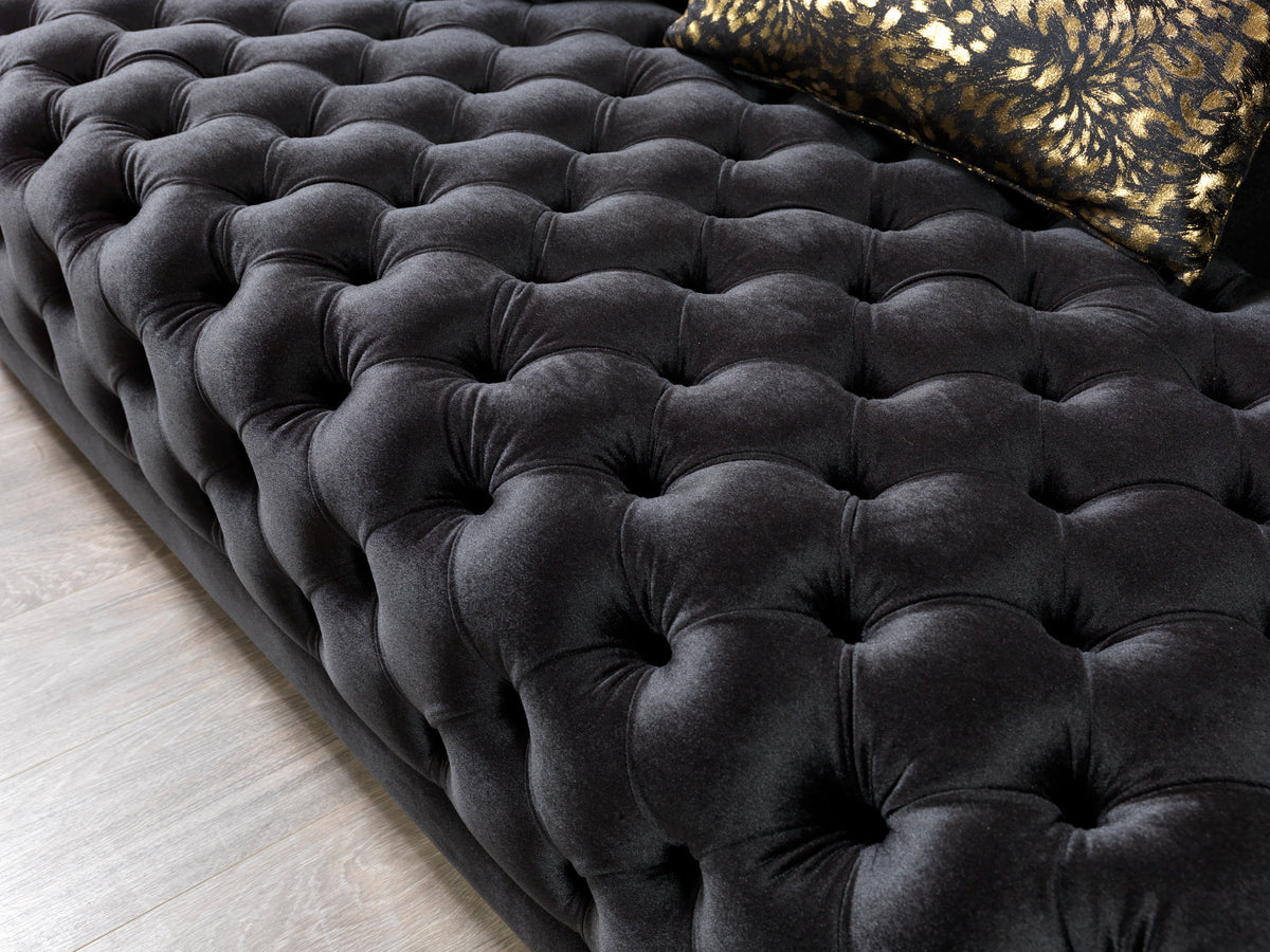 Loveseat side view with black velvet upholstery
