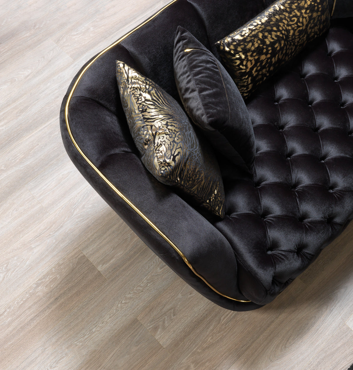 Close-up of sofa armrest in black velvet