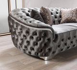angled side view of gray velvet sofa and loveseat