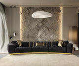 Living room setting with Anne Black Velvet Curved Sectional Sofa