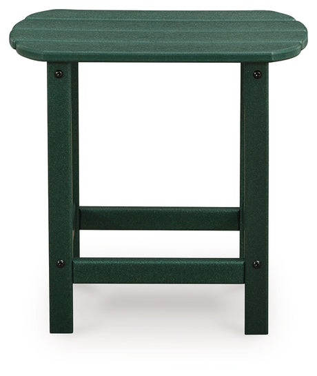 Green Adirondack chair showing slatted design