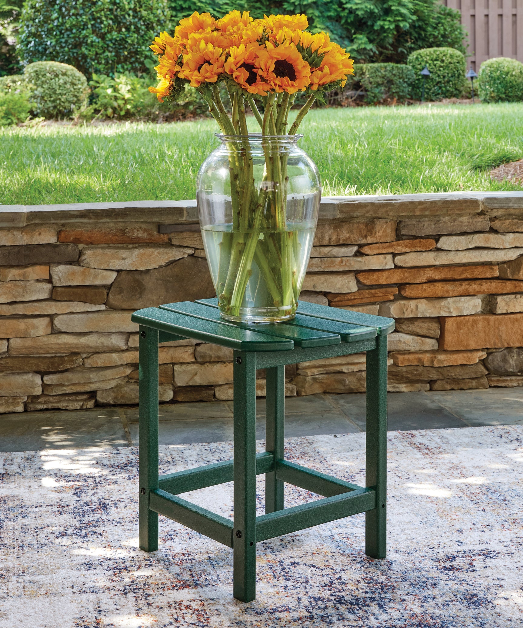 Close-up of green Adirondack chair seat and armrest