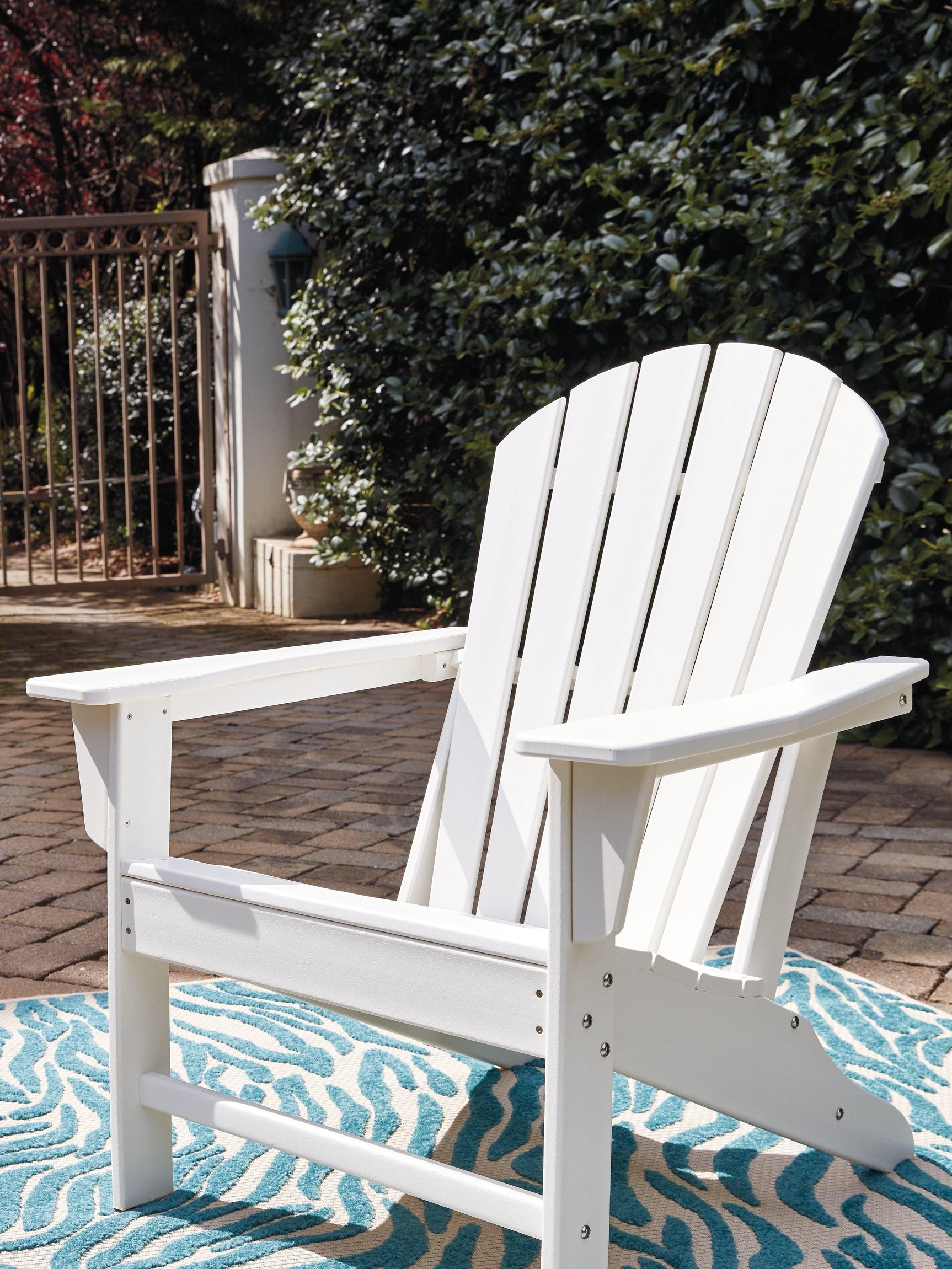 Sundown Treasure Driftwood Adirondack Chair with slatted back and wide armrests