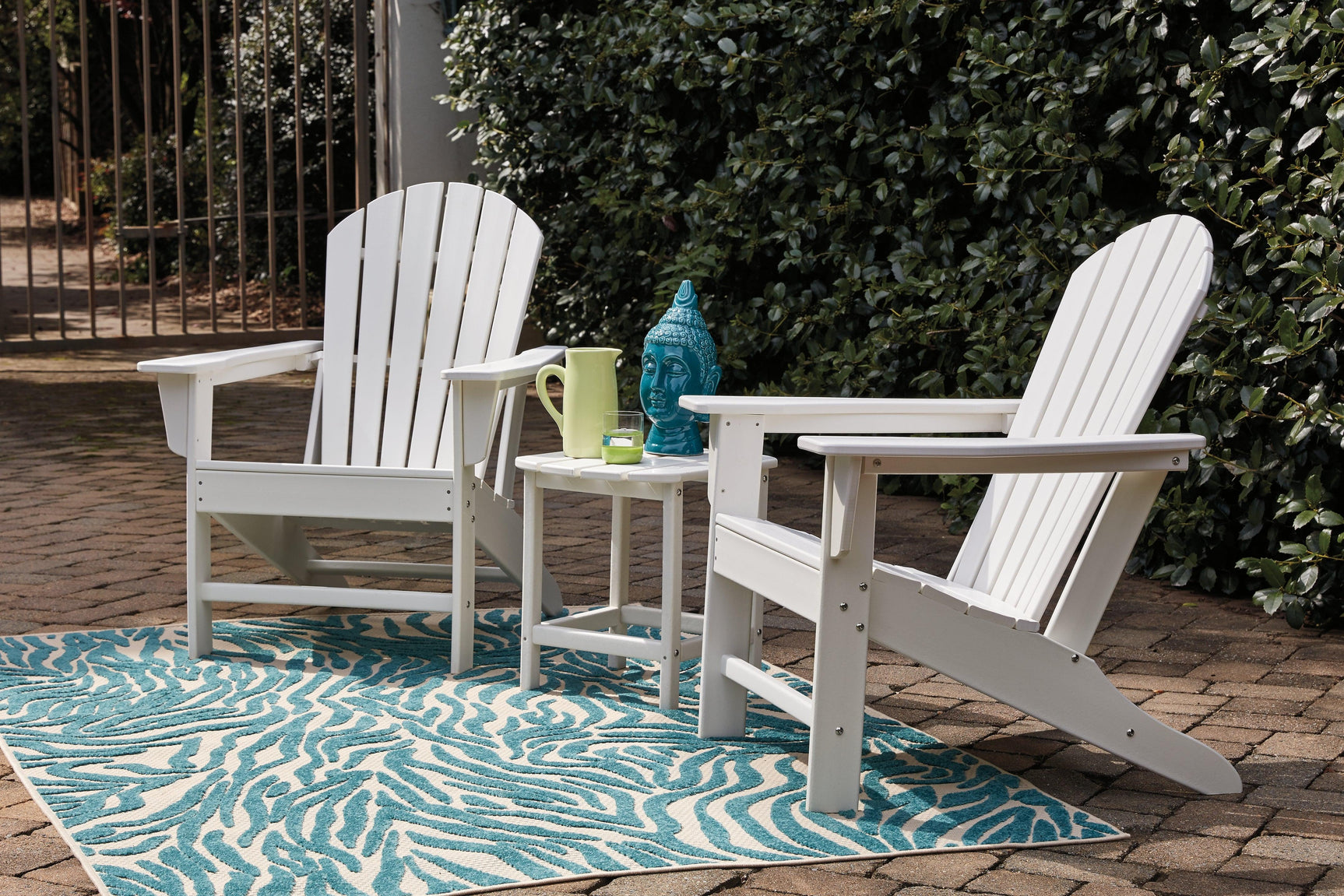 Sundown Treasure Driftwood Adirondack Chair with slatted back and wide armrests