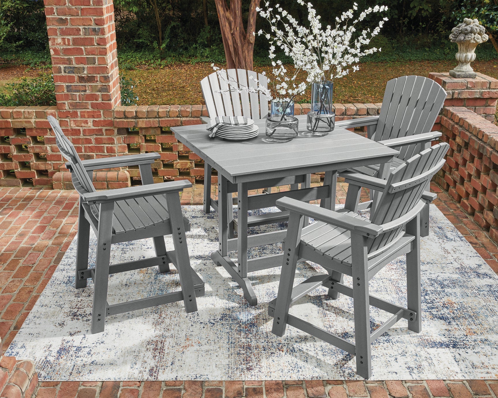 Mood shot of Sanctuary outdoor dining set on deck