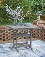 Side angle close-up of table leg and slatted top design