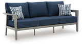 Gali chair with armrest in outdoor setting