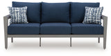 Outdoor sofa seat cushion detail with throw pillow