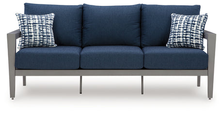 Outdoor sofa seat cushion detail with throw pillow