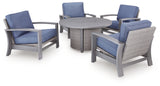 Fire pit table with flame lit and 4 chairs surrounding