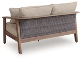 Back view of Harmony Outdoor Sofa showing wood-look aluminum frame