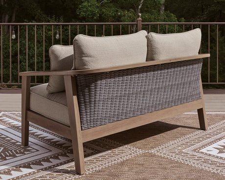 Harmony Outdoor Sofa with cushions in outdoor patio setting