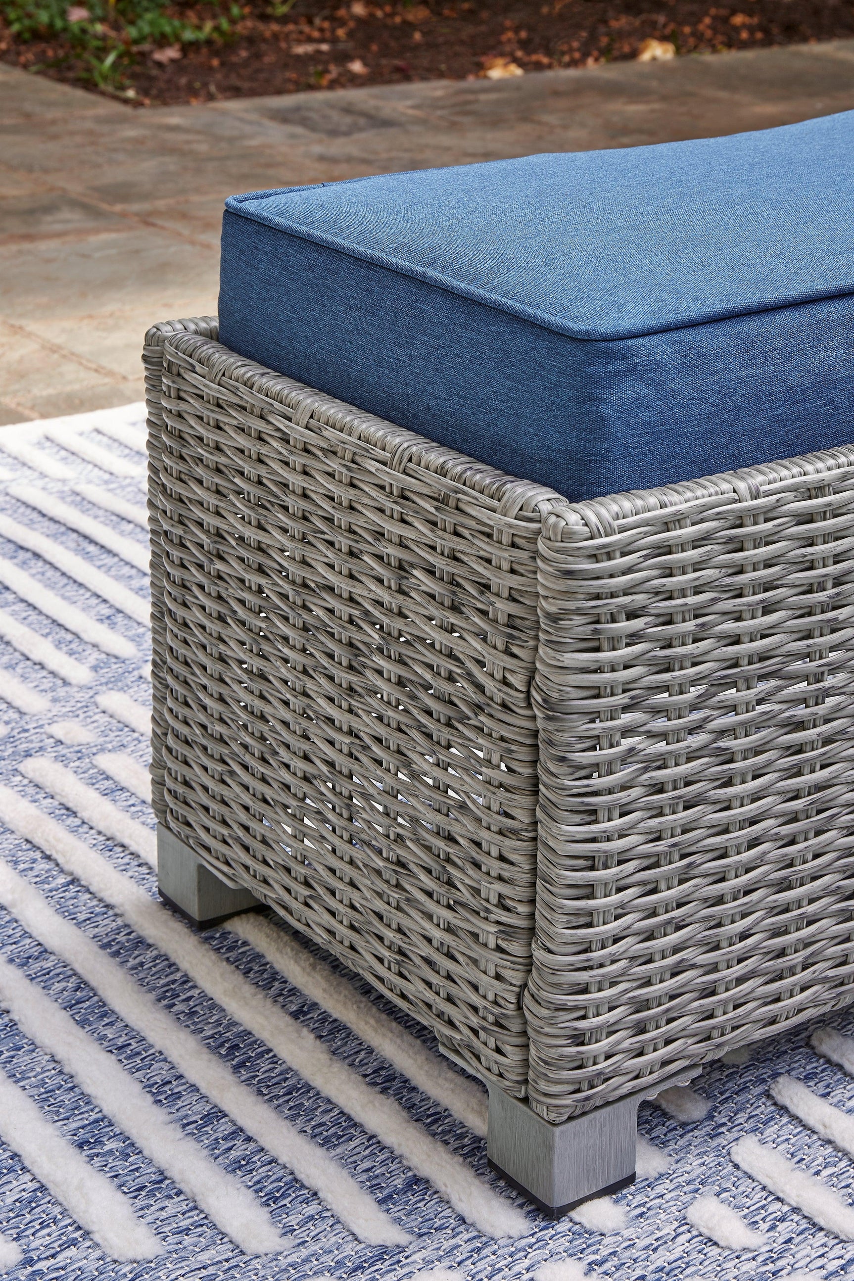 Detailed view of bench legs and wood-look finish