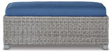 Side view of outdoor bench with cushion