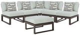 Black aluminum frame and resin wicker back detail on sectional sofa
