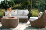 Double beige outdoor sofa set with loveseat, lounge chairs, and coffee table