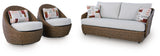 Double beige outdoor sofa set with loveseat, lounge chairs, and coffee table