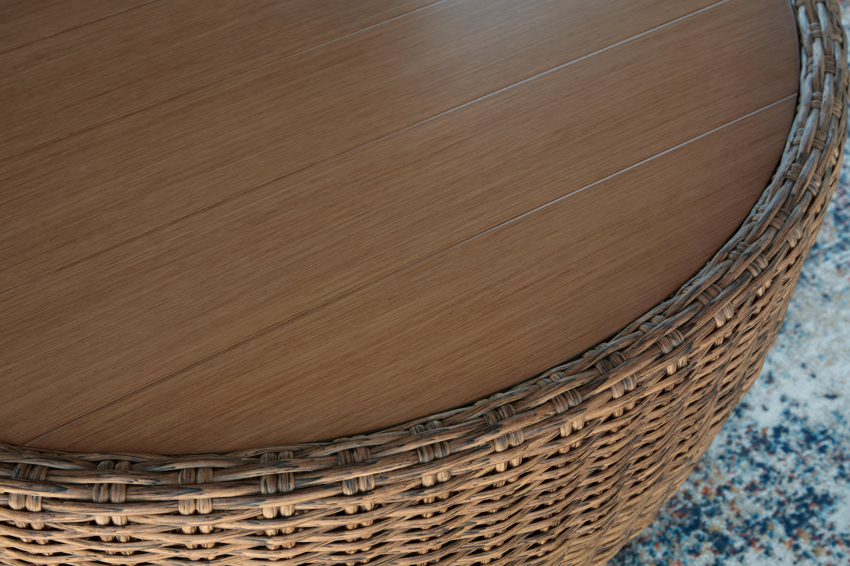 Close-up detail of woven resin wicker and stainless steel hardware