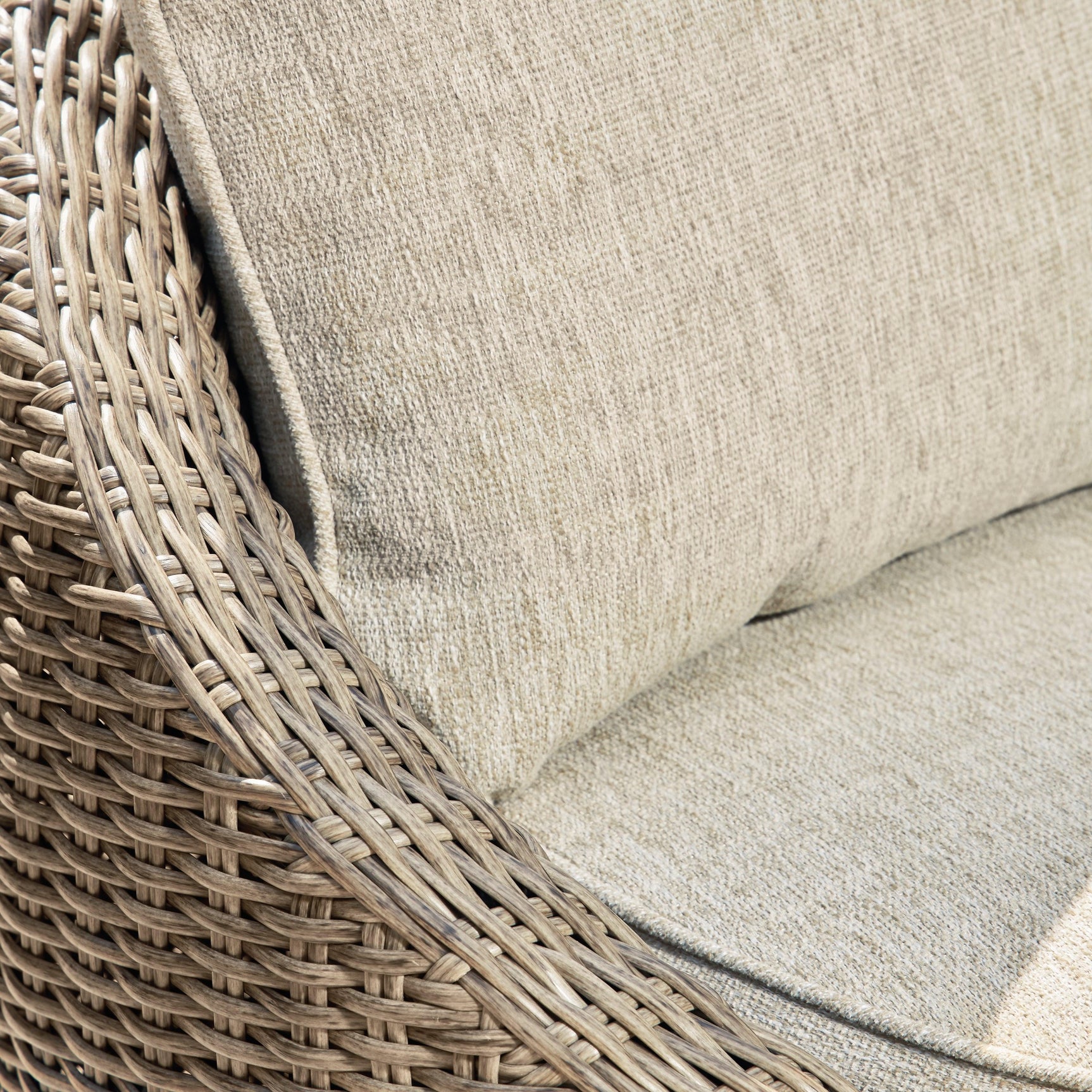 Detail of resin wicker and cushion on Danson Swivel Lounge Chair