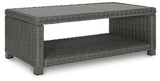 Angled view of loveseat and coffee table set on patio