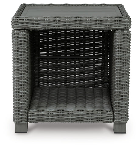 End table side angle showcasing frame and wicker