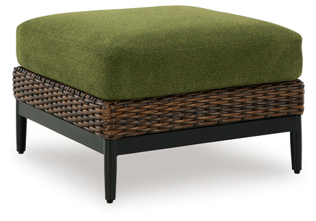 Horizon Hall ottoman angled side view showing resin wicker
