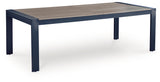 Side view of East Beach outdoor dining table showing navy blue frame and driftwood top