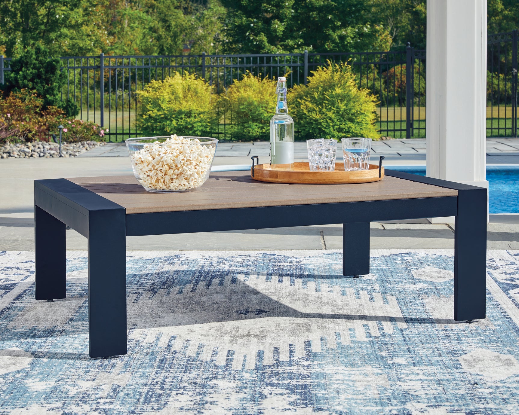 Outdoor sofa, loveseat, and coffee table set in navy blue and driftwood finish