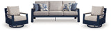 Left angle view of navy blue sofa with driftwood frame