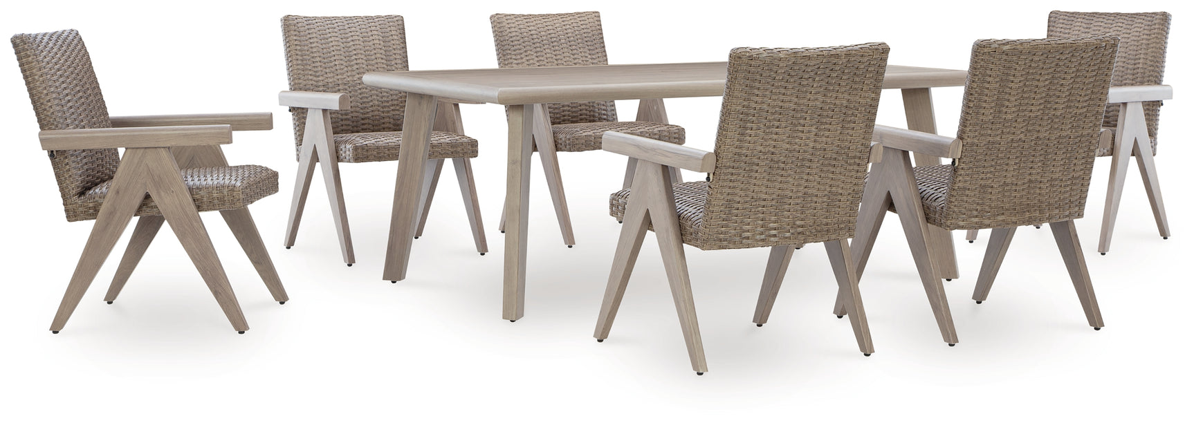 Wicker chairs arranged around dining table