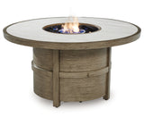 Fire Pit Table lit with flames at night