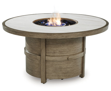 Fire Pit Table lit with flames at night