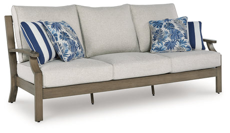 Rainier Ranch outdoor sofa with brown and beige cushions, angled view