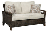 Handwoven resin wicker detail on Paradise Trail Loveseat armrest