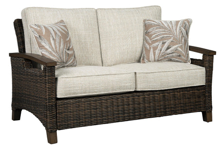 Handwoven resin wicker detail on Paradise Trail Loveseat armrest