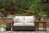 Paradise Trail outdoor loveseat with cushion on patio