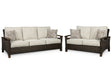 Side angle of Paradise outdoor loveseat with brown resin wicker
