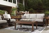 Paradise Trail Medium Brown Outdoor Sofa styled on patio