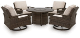 Monterey fire pit table with flame burning at night