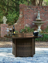 Close-up of resin wicker and aluminum tabletop