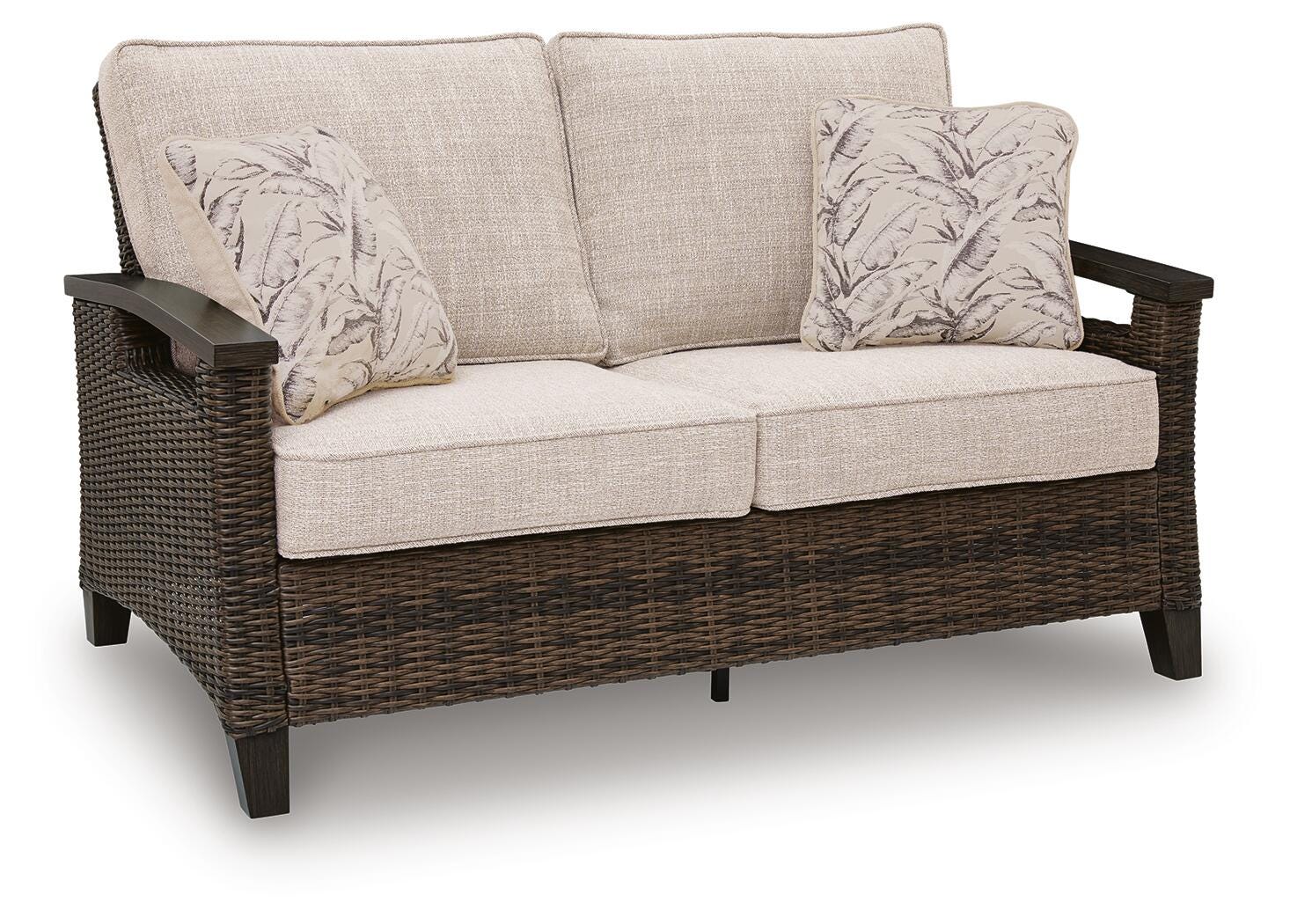 Close-up of Monterey Point loveseat seat cushions and throw pillows