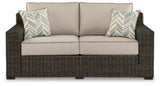 Side view of Coastline Bay Brown outdoor loveseat highlighting arm height