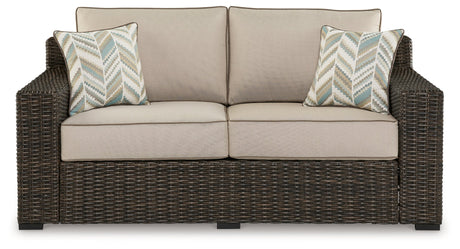 Side view of Coastline Bay Brown outdoor loveseat highlighting arm height