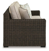 Back view of Coastline Bay brown loveseat showing wicker weave and frame