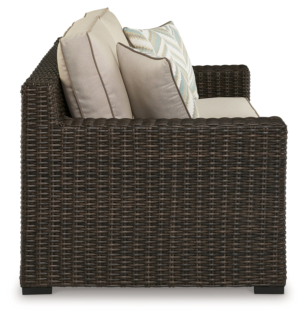 Back view of Coastline Bay brown loveseat showing wicker weave and frame
