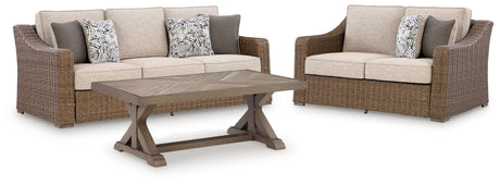 Loveseat side view showing beige cushions